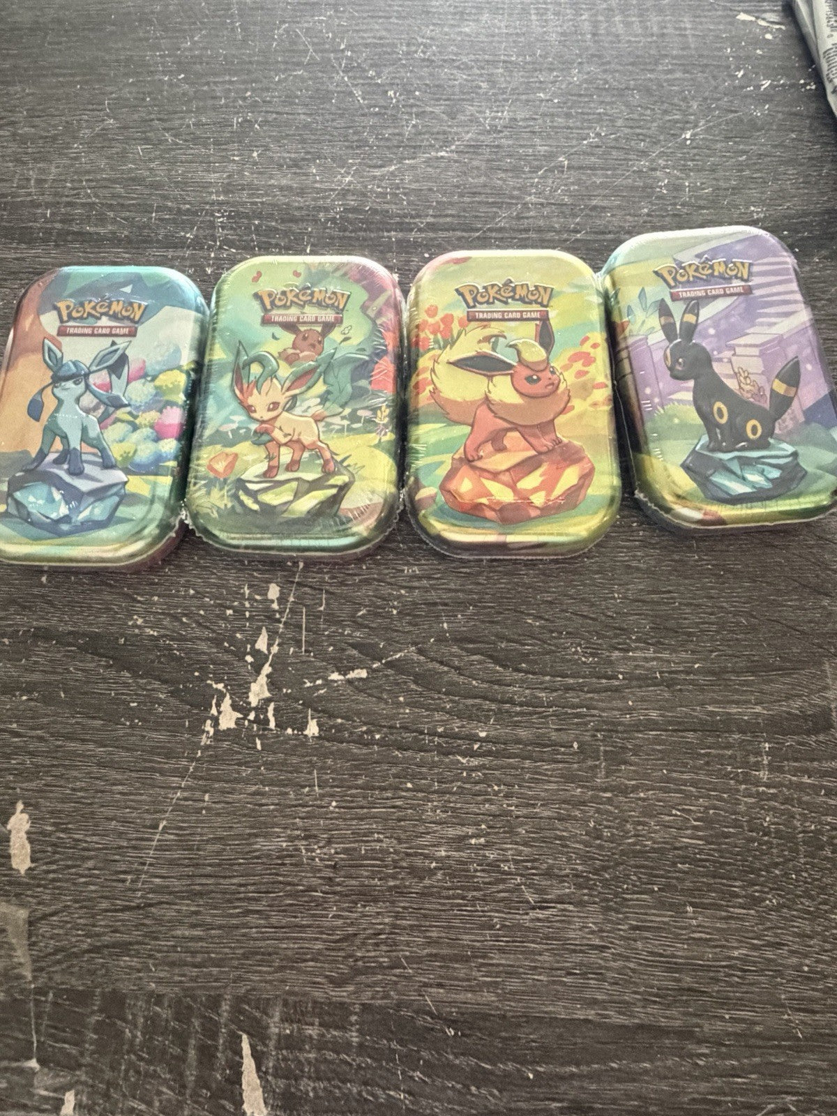 Pokemon PRISMATIC EVOLUTIONS 1 Random  Mini Tins New With Cards Sealed.