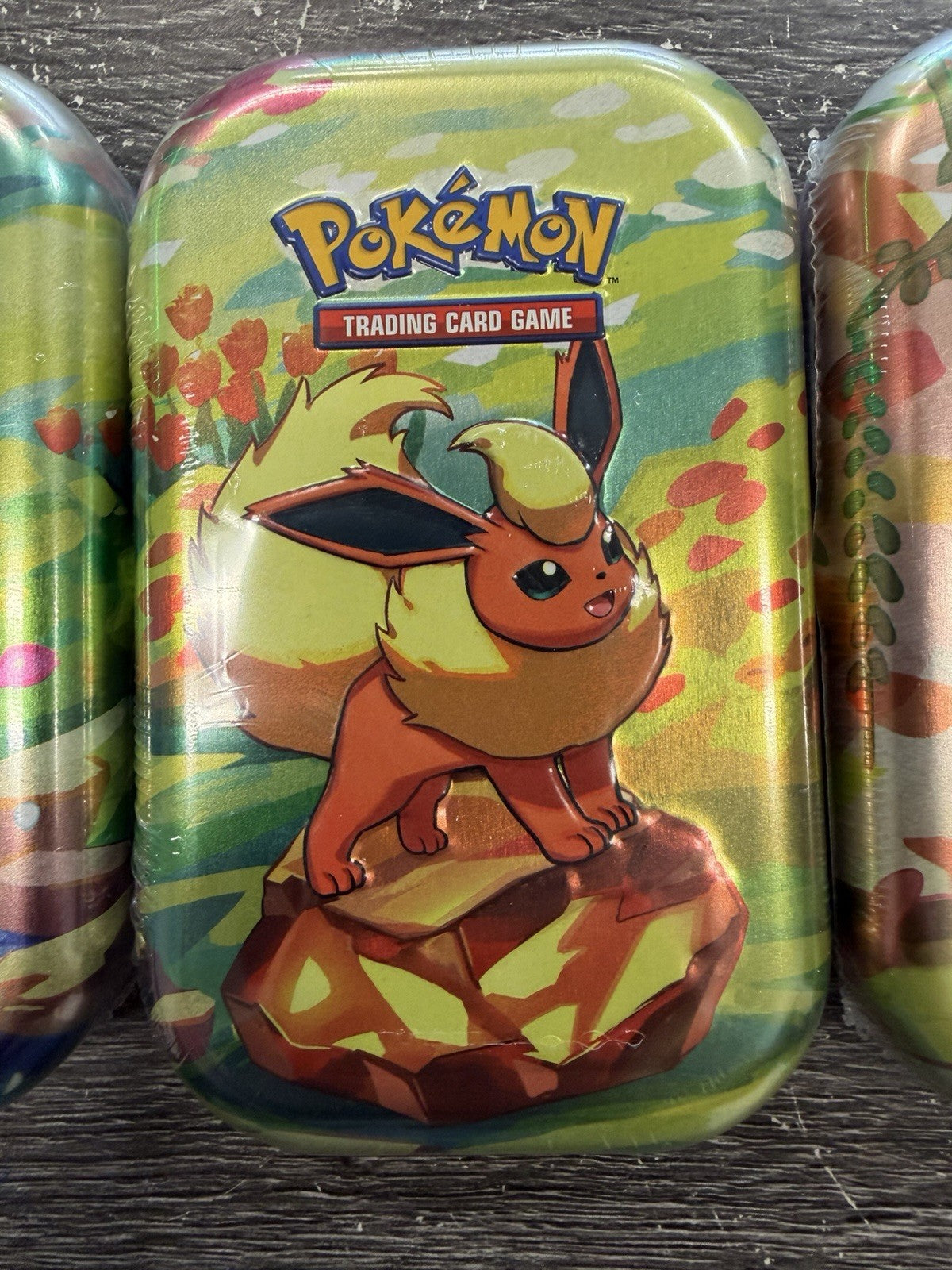 Pokemon PRISMATIC EVOLUTIONS 1 Random  Mini Tins New With Cards Sealed.